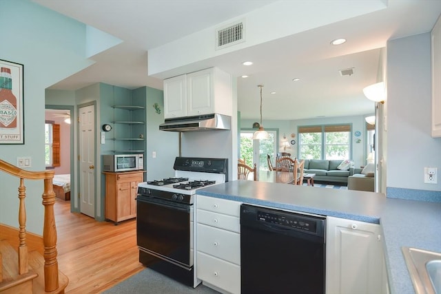 kitchen featuring light wood-type flooring, white cabinetry, dishwasher, pendant lighting, and white gas range oven