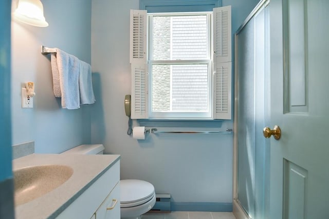 bathroom featuring a baseboard radiator, toilet, vanity, and an enclosed shower