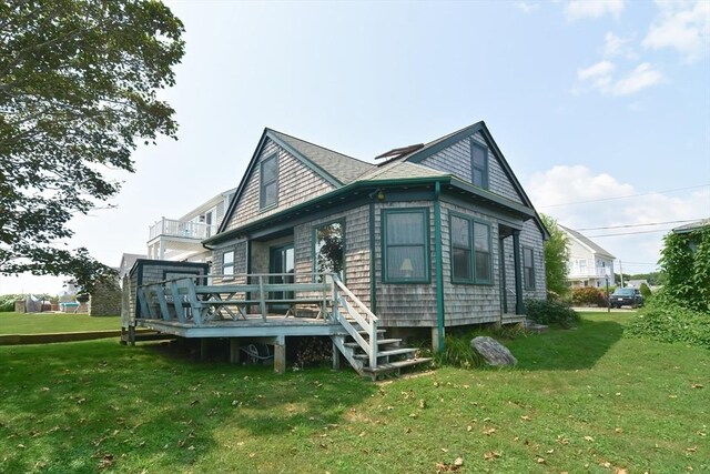 back of house with a yard and a wooden deck