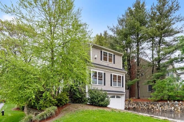 38 Paul Revere Rd, Lexington, MA 02421 - view of front of house featuring a garage and a front yard