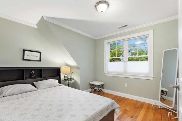 38 Paul Revere Rd, Lexington, MA 02421 - bedroom with ornamental molding, baseboards, and wood finished floors