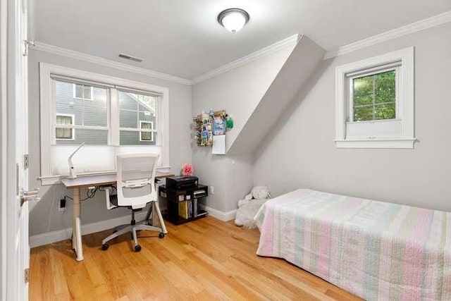 38 Paul Revere Rd, Lexington, MA 02421 - bedroom with multiple windows, ornamental molding, wood finished floors, baseboards, and a desk