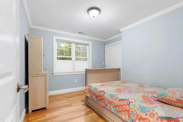 38 Paul Revere Rd, Lexington, MA 02421 - bedroom featuring light wood-type flooring, ornamental molding, and baseboards