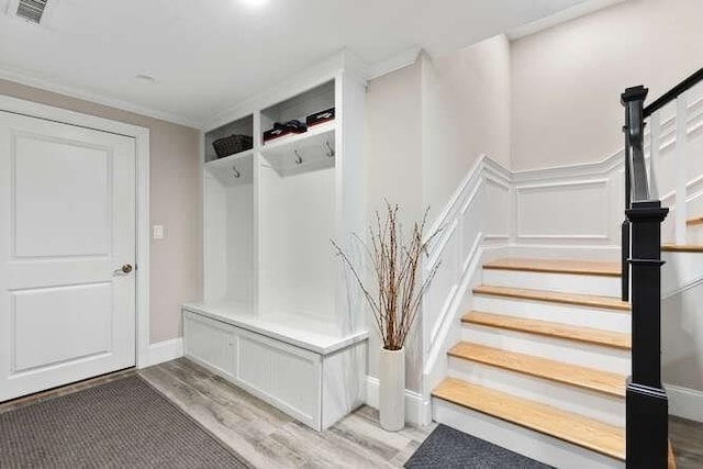 38 Paul Revere Rd, Lexington, MA 02421 - mudroom with light wood finished floors and ornamental molding
