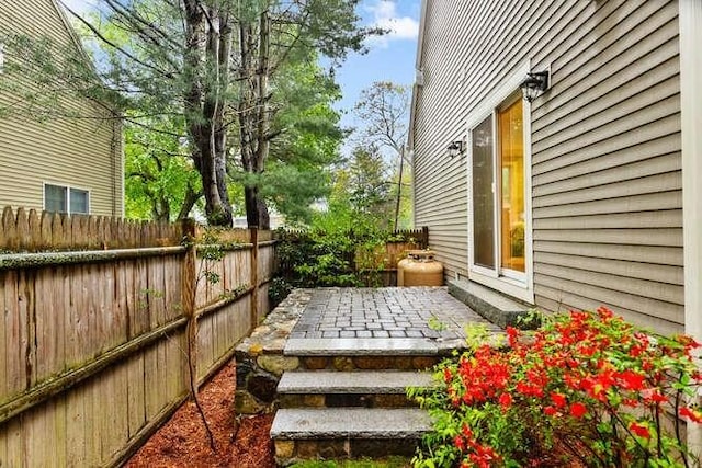 38 Paul Revere Rd, Lexington, MA 02421 - fenced backyard featuring a patio area