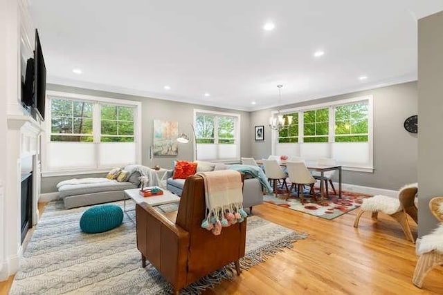 38 Paul Revere Rd, Lexington, MA 02421 - living room featuring light wood-style flooring, recessed lighting, crown molding, a fireplace, and baseboards