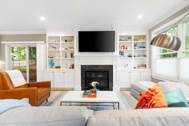 38 Paul Revere Rd, Lexington, MA 02421 - living room with plenty of natural light, ornamental molding, a fireplace with flush hearth, and recessed lighting
