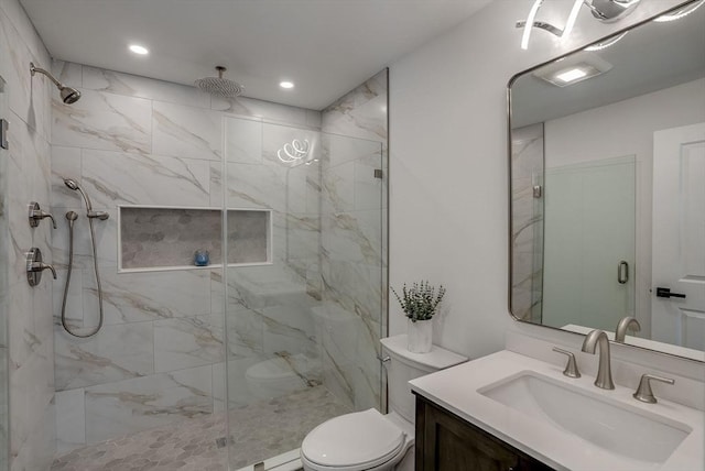 bathroom with recessed lighting, toilet, vanity, and a marble finish shower