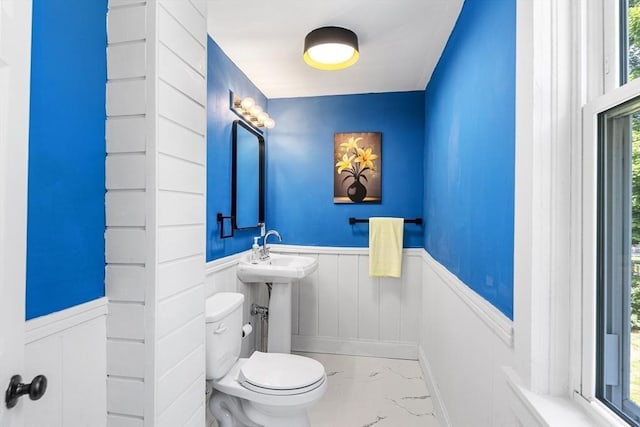 186 Chapel St, Abington, MA 02351 - bathroom featuring wainscoting, marble look tiles, and toilet