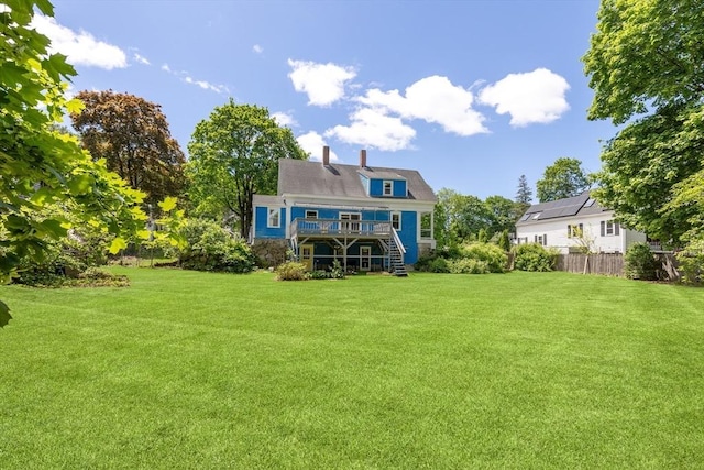 186 Chapel St, Abington, MA 02351 - rear view of property featuring stairway, a deck, and a chimney