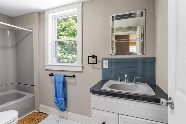 186 Chapel St, Abington, MA 02351 - bathroom featuring baseboards, vanity, toilet, tub / shower combination, and marble look tiles