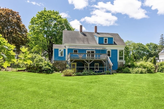 186 Chapel St, Abington, MA 02351 - back of property with a wooden deck, a yard, a chimney, and stairs