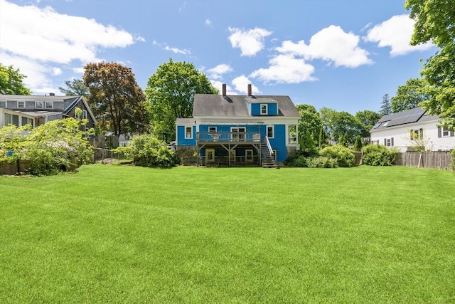 186 Chapel St, Abington, MA 02351 - back of property featuring stairway, a deck, and a chimney