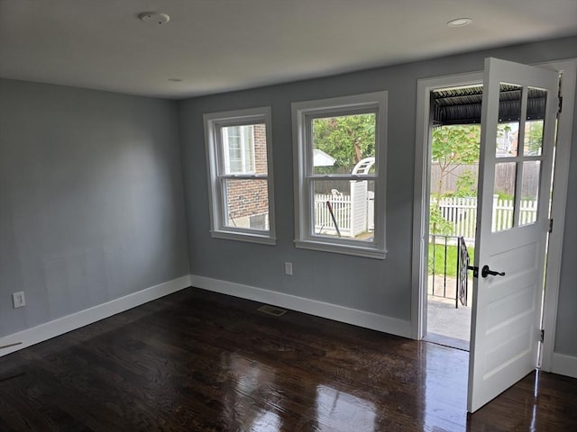 32 Central Ave, Everett, MA 02149 - doorway to outside featuring dark wood-style floors and baseboards