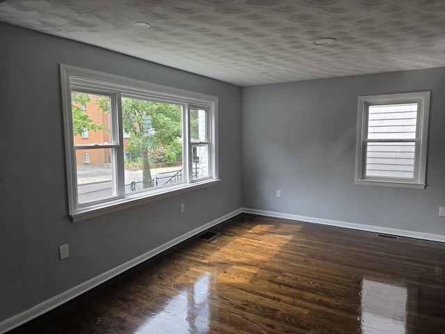 32 Central Ave, Everett, MA 02149 - spare room featuring baseboards and dark wood finished floors