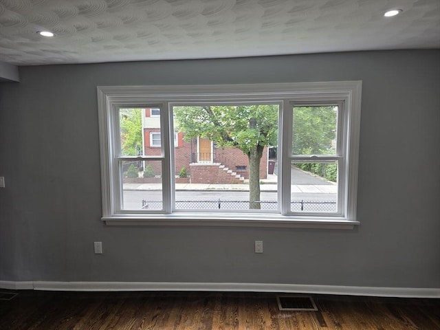 32 Central Ave, Everett, MA 02149 - unfurnished room featuring healthy amount of natural light, baseboards, recessed lighting, and wood finished floors