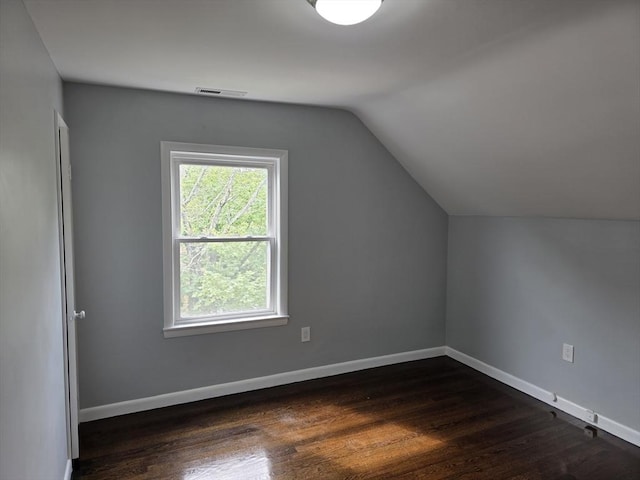 32 Central Ave, Everett, MA 02149 - bonus room featuring lofted ceiling, dark wood-style flooring, and baseboards