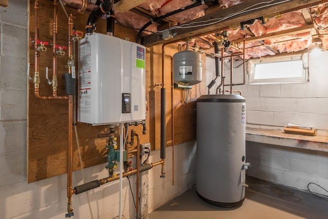 utility room featuring gas water heater and water heater