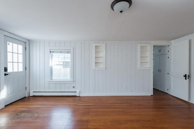 entrance foyer featuring dark wood-style floors and baseboard heating