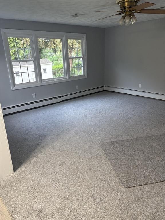 945 Shoemaker Ln, Agawam, MA 01030 - carpeted spare room with a ceiling fan