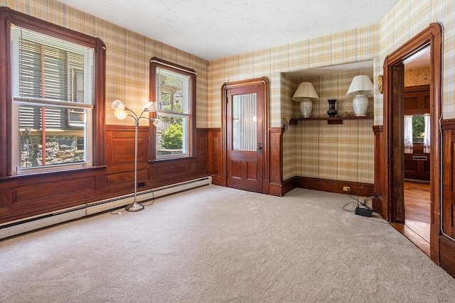 14 Franklin Ter, Boston, MA 02136 - carpeted spare room featuring wallpapered walls, baseboard heating, and a wainscoted wall