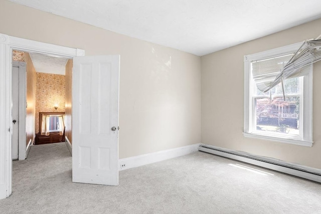 14 Franklin Ter, Boston, MA 02136 - spare room with carpet floors and a baseboard heating unit