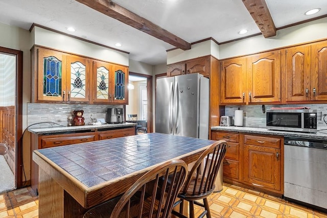 14 Franklin Ter, Boston, MA 02136 - kitchen with stainless steel appliances, beamed ceiling, tile countertops, brown cabinets, and recessed lighting