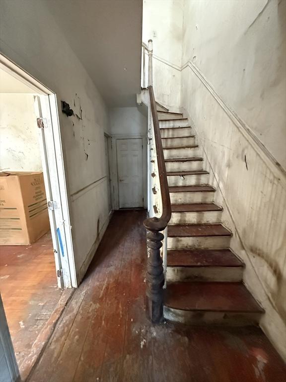 stairs with wood-type flooring