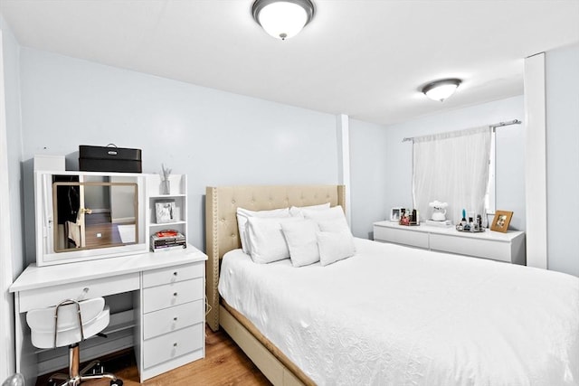 bedroom with wood finished floors