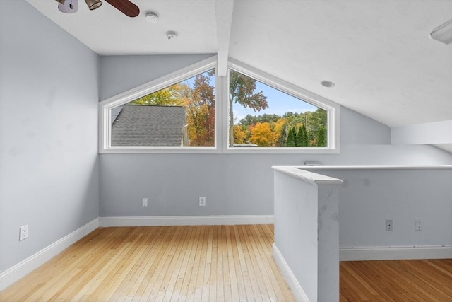 bonus room featuring ceiling fan, light hardwood / wood-style flooring, and lofted ceiling