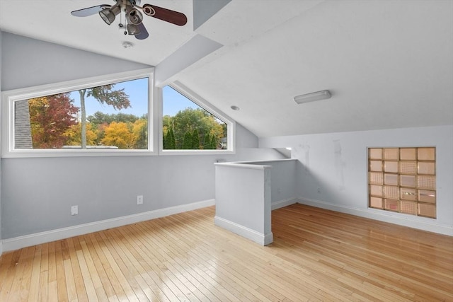 bonus room featuring vaulted ceiling with beams, ceiling fan, and light hardwood / wood-style floors