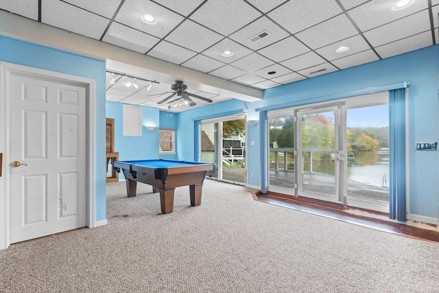 recreation room with a water view, ceiling fan, carpet floors, and pool table