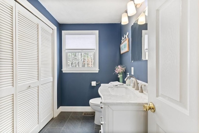 2 Spencer Way, Merrimac, MA 01860 - bathroom featuring tile patterned flooring, vanity, toilet, baseboards, and a closet