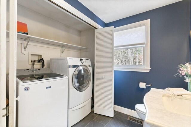 2 Spencer Way, Merrimac, MA 01860 - clothes washing area with dark tile patterned floors, baseboards, washing machine and clothes dryer, visible vents, and laundry area