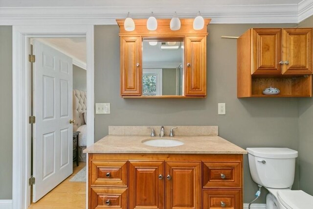 2 Spencer Way, Merrimac, MA 01860 - bathroom with toilet, vanity, crown molding, and wood finished floors