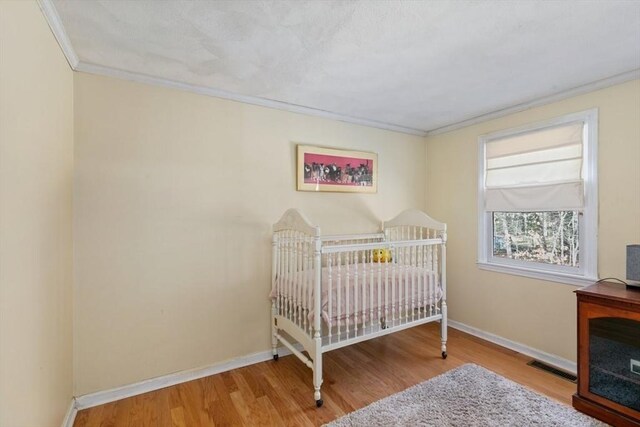 2 Spencer Way, Merrimac, MA 01860 - bedroom with baseboards, visible vents, crown molding, and wood finished floors