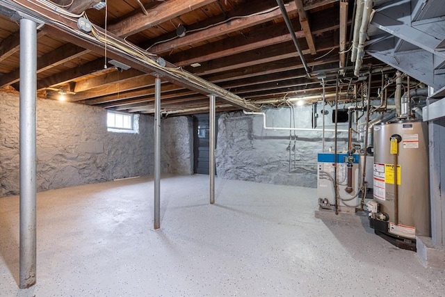 below grade area featuring a heating unit and gas water heater