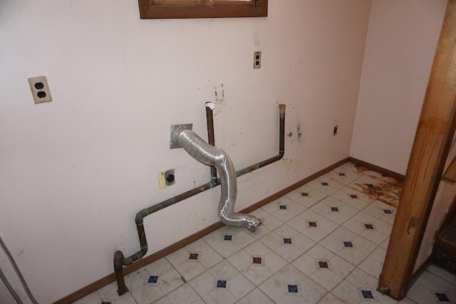 washroom with light tile patterned floors, laundry area, electric dryer hookup, and hookup for a gas dryer