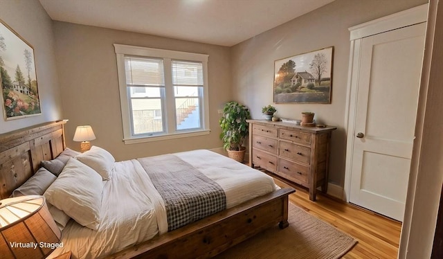 bedroom with light hardwood / wood-style floors