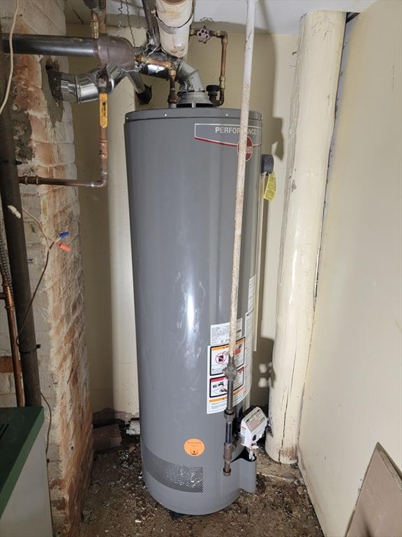 utility room with gas water heater