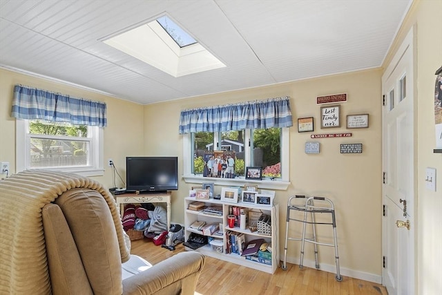 68 Spring Rd, Nahant, MA 01908 - living area featuring a skylight, wood finished floors, and baseboards
