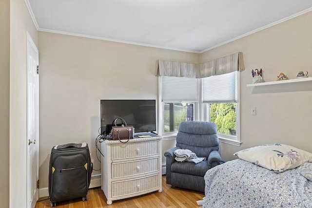 68 Spring Rd, Nahant, MA 01908 - bedroom featuring wood finished floors, crown molding, and a baseboard radiator