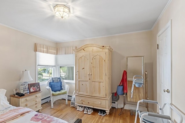 68 Spring Rd, Nahant, MA 01908 - bedroom featuring light wood-style floors, crown molding, and a baseboard heating unit