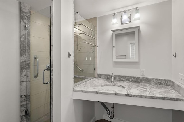 full bath featuring a shower stall and a sink