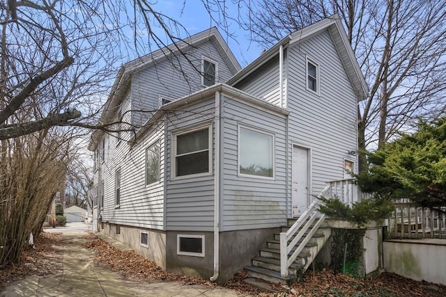 view of property exterior with stairway