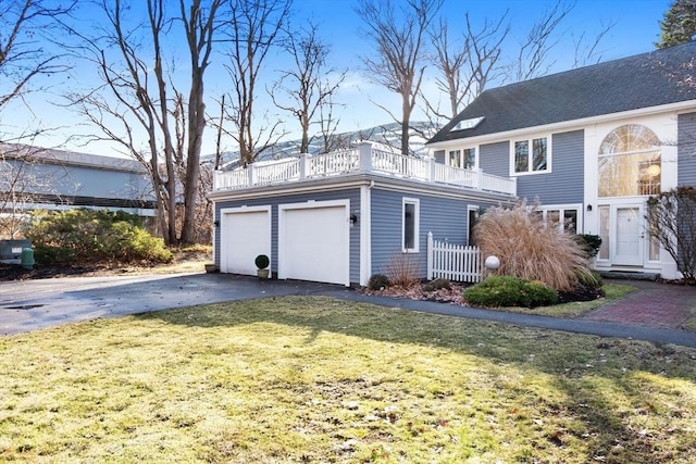18 Hawkswood Ests Unit 18, Amesbury, MA 01913 - view of front facade featuring a detached garage, a front yard, and a balcony