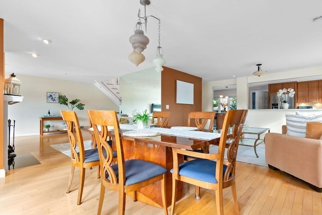 18 Hawkswood Ests Unit 18, Amesbury, MA 01913 - dining area featuring light wood finished floors and stairs