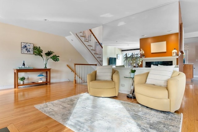 18 Hawkswood Ests Unit 18, Amesbury, MA 01913 - living room with stairway, baseboards, wood finished floors, and a fireplace