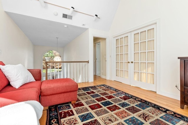 18 Hawkswood Ests Unit 18, Amesbury, MA 01913 - living room with vaulted ceiling, french doors, wood finished floors, and visible vents
