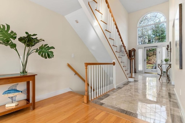18 Hawkswood Ests Unit 18, Amesbury, MA 01913 - entryway with stairway, a high ceiling, baseboards, and wood finished floors